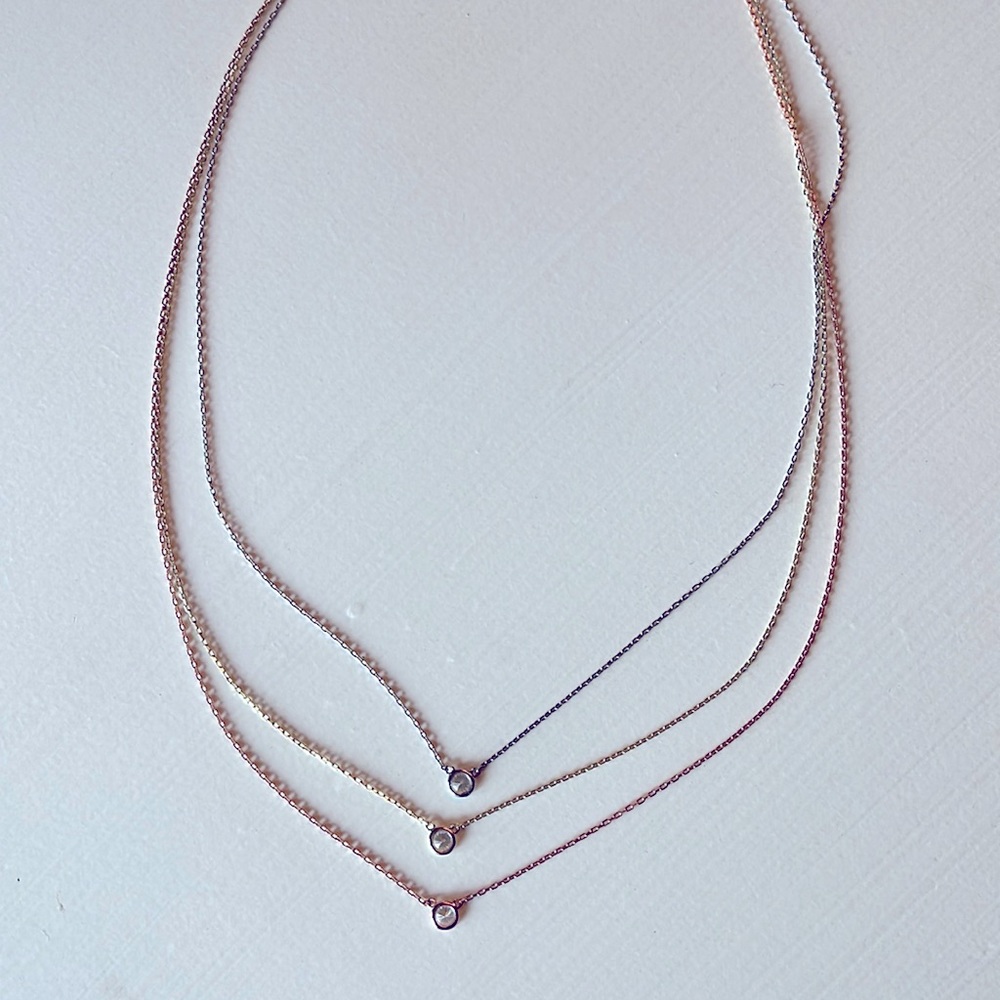 Dainty necklace with three chains.